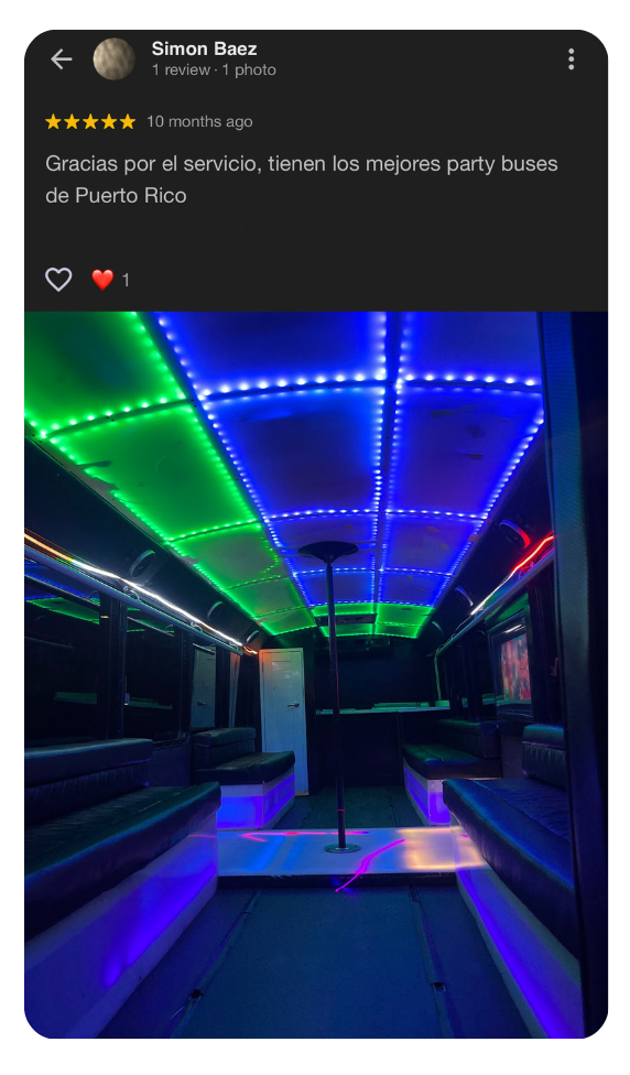 Customer review and LED-lit interior of Puerto Rico party bus with pole and lounge seating